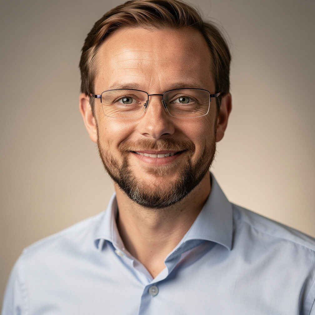 Portrait of a Belgian man facilitator with glasses